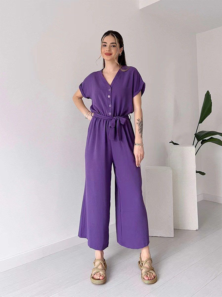 "Sleeveless V-neck red jumpsuit with a belt"